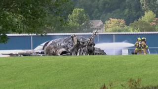 Firefighters tackle flames engulfing an aircraft that crashed in Tennessee