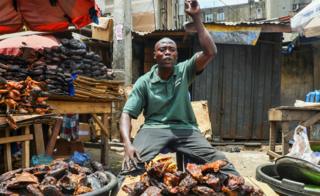 A fisher seller at a market in Lagos, Nigeria - Monday 30 March 2020