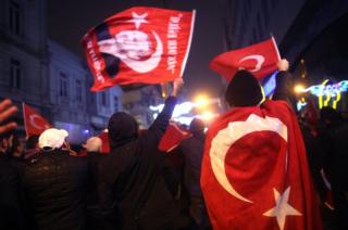 Supporters of Turkish President Recep Tayyip Erdogan shout slogans in front of the Netherlands' consulate in Istanbul, Turkey, 12 March 2017.
