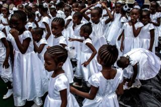 Young Catholic faithful are seen at the inauguration of the new Archbishop of Kinshasa, Fridolin Ambongo, in Kinshasa, DR Congo - November 25, 2018