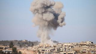 Smoke rises from rebel-held area of Deraa, Syria, after an air strike (17 February 2016)