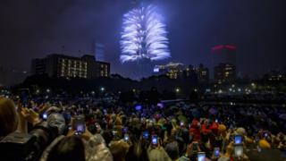 Fireworks and light effects illuminate the night sky from the Taipei 101 skyscraper during New Year's Eve celebrations in Taipei, Taiwan, 1 January 2019