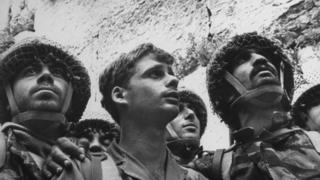 Israeli paratroopers gaze at Western (aka Wailing) Wall moments after recapture of Jewish holy site in Six-Day War, 1967