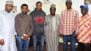 Uchenna Abia and Kenneth Eboh pose with members of the Nigerian Diaspora Commission