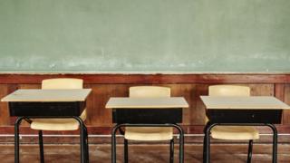 Emtpy classroom desks