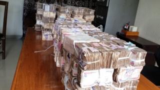 Plenti money ontop table