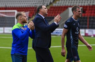 Ross County manager Malky Mackay and his players celebrate their recent win over Airdrieonians
