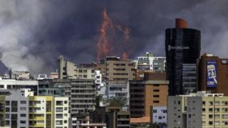 Handout photo released by Agencia Andes of a fire in the Auqui hill seen from the north of Quito on September 15, 2015.