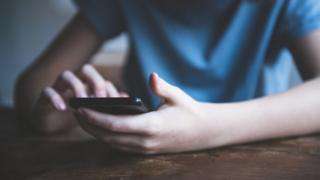 teen on phone