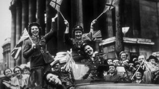 Members of the Auxiliary Territorial Service (ATS), driving through Trafalgar Square in a service vehicle during the VE Day celebrations in London, 8th May 1945.