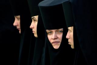 Orthodox nuns take part in a religious procession