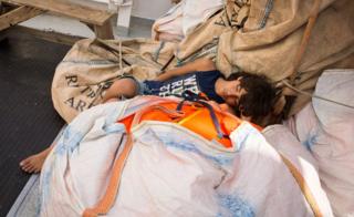 A rescued migrant sleeping at the Aquarius rescue ship