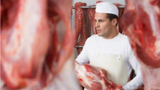 Butcher with meat