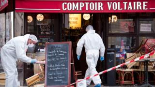 Forensics officers outside the Comptoir Voltaire cafe