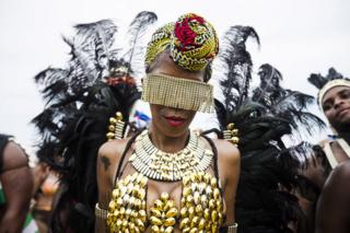 Revellers take part in the Caribbean Carnival Grand Parade in Toronto