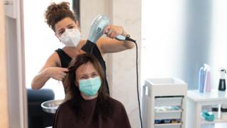 Woman having haircut