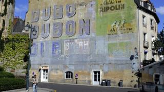 Dubonnet ad painted on side of building