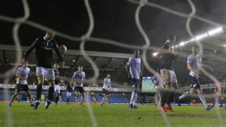 Millwall's Jake Cooper handles the ball before scoring an equaliser against Everton in the FA Cup.