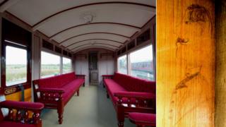 Restored carriage with (inset) the sketch of a Victorian man