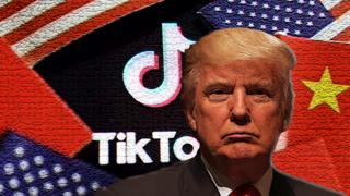 Donald Trump in front of TikTok sign and American and Chinese flags.