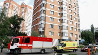 emergency vehicles by a building in Moscow