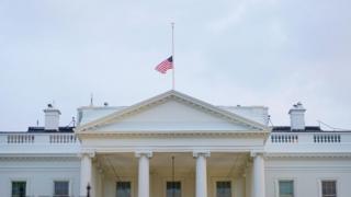 US flag flies at half-mast above the White House after the death of Senator John McCain