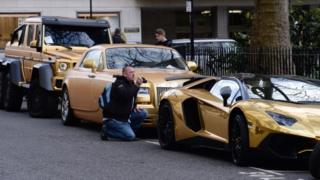 Fleet of gold cars in Knightsbridge