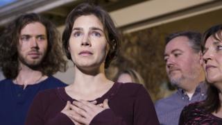 Amanda Knox speaking at a press conference with her family after she was acquitted of murder in 2015