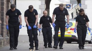 Police searching a road in Brecon