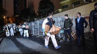 Turkish forensic police officers leave after searching for evidence at the Saudi Arabian Consulate on October 18, 2018 in Istanbul