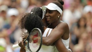 Venus and Serena Williams embrace.