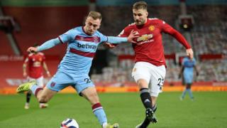 West Ham's Jarrod Bowen is challenged by Man Utd's Luke Shaw