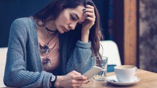 Woman looking at her phone