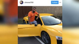Adam Ali with a sports car