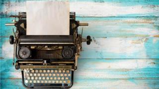 Typewriter with paper