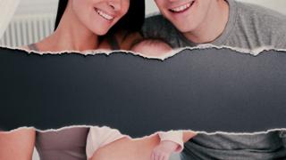 A couple holding a baby with a rip