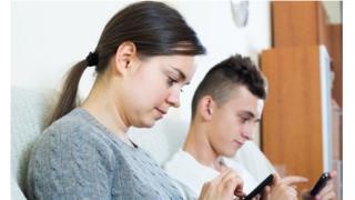 Mother texting with son