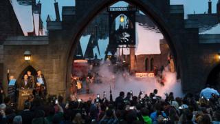 Fans get ready to enter Hogsmeade at the Grand Opening of the Wizarding World of Harry Potter" at Universal Studios Hollywood, in Universal City, California.