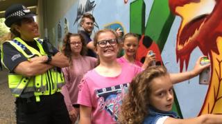 Kids painting the mural on the underpass in Pontypridd