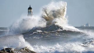 Waves crash against the pier wall at Seaham Lighthouse on the County Durham coast as weather warnings remain in owing to strong winds from Storm Atiyah.