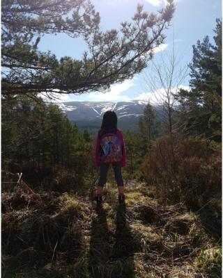 girl hiking to Lochan Uaine in Glenmore