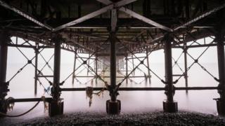 A grey and murky morning underneath Worthing Pier