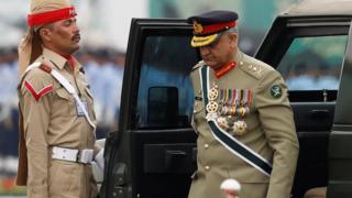 Pakistan's army chief General Qamar Javed Bajwa seen exiting a vehicle at the Pakistan Day military parade in March