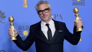 Alfonso Cuarón poses poses in the press room during the 76th Annual Golden Globe Awards
