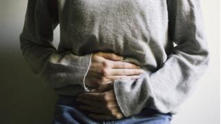 Foto de mujer con dolor