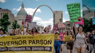Attendees chant and march through downtown St Louis during a rally and march to protest the closure of the last abortion clinic in Missouri on 30 May, 2019 in St Louis, Missouri