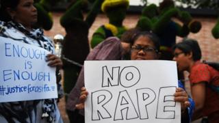 Indian social activists hold placards during a protest calling for justice following the rape and murder of an eight-year-old girl in the Indian state of Jammu and Kashmir in Kolkata on April 18, 2018.