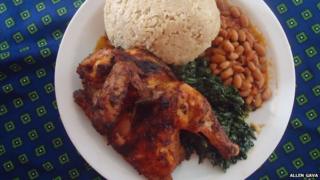 A meal at Gava's Restaurant, chicken, beans, sadza, and green vegetables