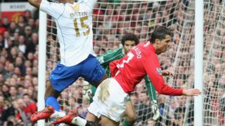 Distin tackles Ronaldo during the 2008 FA Cup quarter final between Manchester United and Portsmouth.