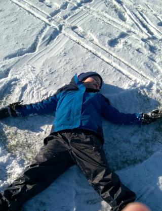 Image of a child making a snow angel